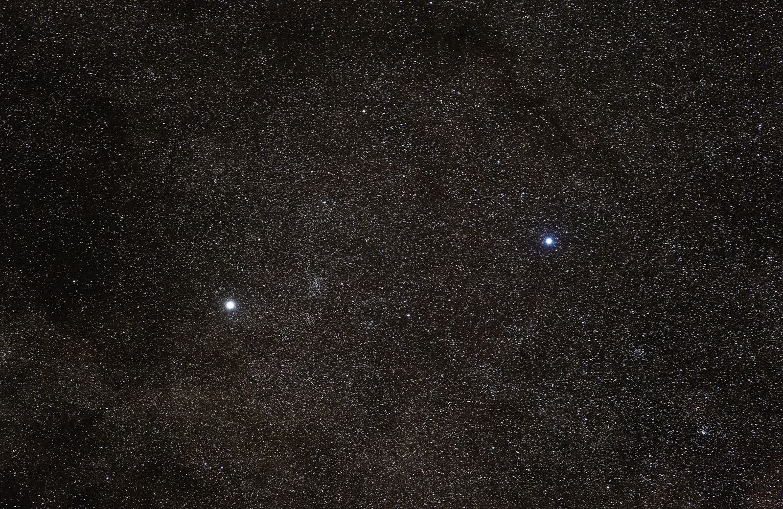 A wide view of the southern Milky Way from ESO's Paranal Observatory: Alpha Centauri, where Toliman (Alpha Centauri B) and its brighter partner merge into one point, is the bright star left of centre, and the bluer star at right is Hadar.