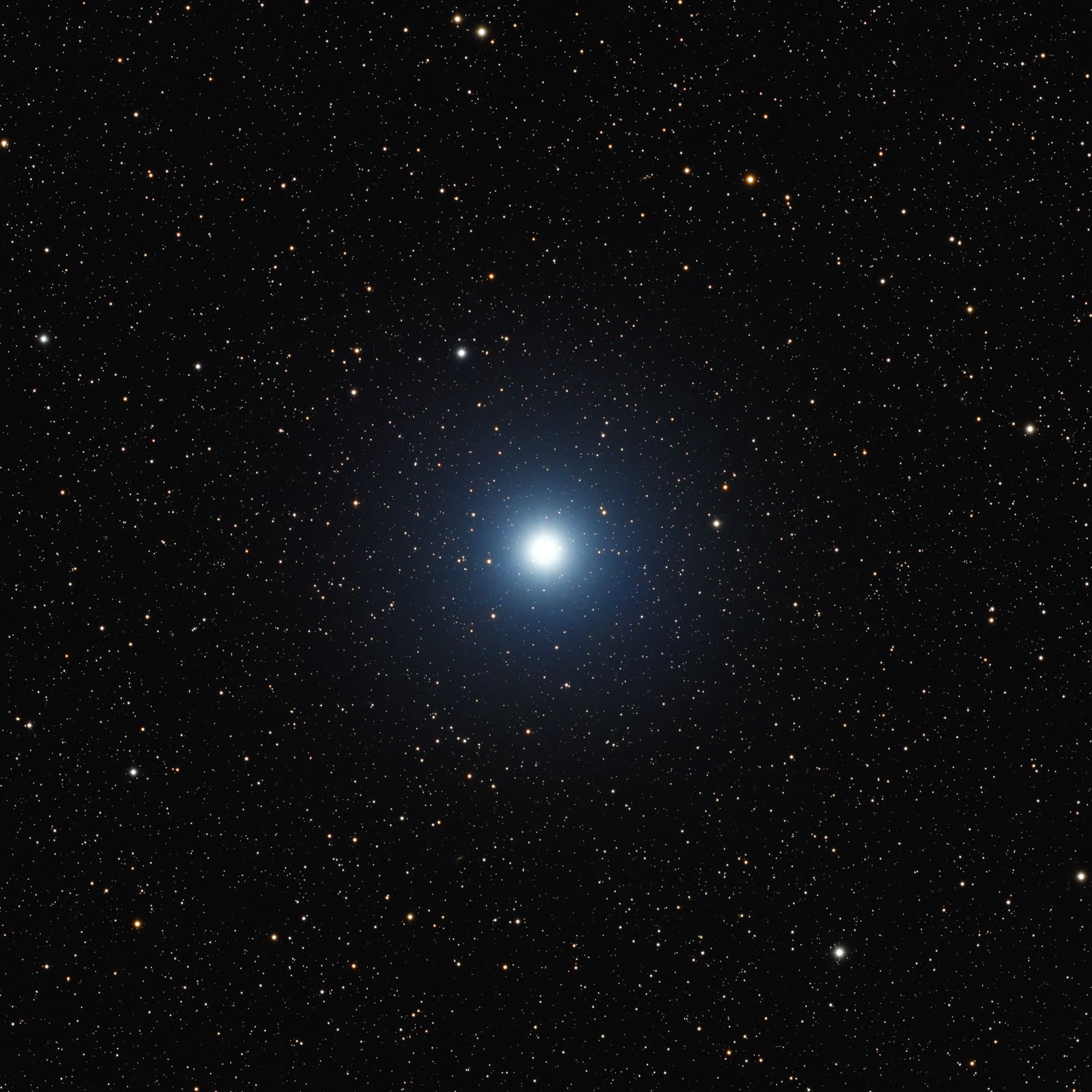Vega, the brightest star in Lyra, blazes at the centre of this telescope image, surrounded by fainter background stars of the Milky Way.